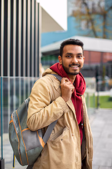 side-view-smiley-man-holding-backpack_23-2149915904